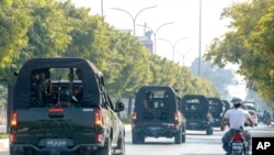 An army convoy patrols the streets in Mandalay, Myanmar, Feb. 3, 2021. In the early hours of Feb. 1, the Myanmar army took over the civilian government of Aung San Suu Kyi in a coup over allegations of fraud in November's elections.