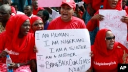 Women attend a demonstration calling on the government to rescue the kidnapped school girls of a government secondary school Chibok, outside the defense headquarters in Abuja, Nigeria, May 6, 2014. 