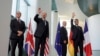 Prime Minister Keir Starmer of the United Kingdom, U.S. President Joe Biden, Chancellor Olaf Scholz of Germany, and President Emmanuel Macron of France, from left, gather at the Chancellery in Berlin, Germany, Oct. 18, 2024.