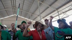 FILE - Mineworkers demonstrate at the entrance of the Gold One Modder East operation mineshaft in Springs on October 25, 2023.