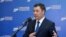 FILE - Kyrgyzstan's President Sadyr Japarov speaks in Bishkek, Kyrgyzstan, April 11, 2021. (Kyrgyz Presidential Press Service/Handout via Reuters)