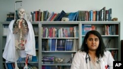 Zarna Patel poses for a portrait at the Loyola University Medical School in Maywood, Ill, Patel, a third year student who was brought to the U.S. from India as a 3-year old without any legal documents, joins others in taking an active role in the debate over the future of an Obama-era program that shields hundreds of thousands of people from deportation, Oct. 5, 2017. 