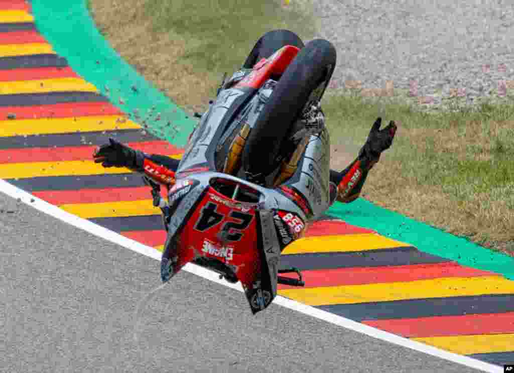 Italian rider Simone Corsi of Team Tasca Racing Scuderia crashes in the Moto2 race at the Sachsenring circuit in Hohenstein-Ernstthal, Germany.