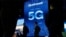 FILE - A sign advertises 5G at the Qualcomm booth at CES International in Las Vegas, Jan. 9, 2019.