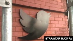 FILE - The Twitter logo on its Chelsea office in New York City, May 13, 2020.