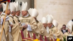 FILE—Cardinals arrive in St. Peter's Square at The Vatican where Pope Francis will celebrate the Easter Sunday mass, March 31, 2024.