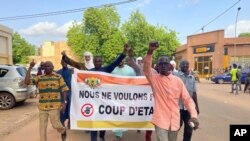 Supporters of Nigerien President Mohamed Bazoum demonstrate in his support in Niamey, Niger, Wednesday July 26, 2023.