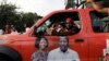 Supporter of the opposition National Democratic Congress drives a campaign vehicle ahead of the December 7th presidential and parliamentary elections in Accra, Ghana, Nov. 21, 2020.