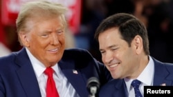 Marco Rubio (kanan) pilihan Donald Trump sebagai Menteri Luar Negeri AS akan mempersulit hubungan Amerika-China (foto: dok). 