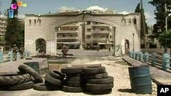 An image taken from video footage broadcast by the Syrian state television on June 14, 2011 shows Syrian troops deployed in the flashpoint town of Jisr al-Shughour