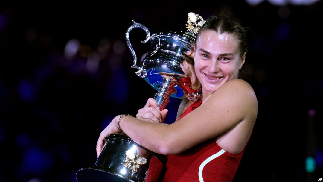 Aryna Sabalenka of Belarus holds the Daphne Akhurst Memorial Cup after defeating Zheng Qinwen of China in the women's singles final at the Australian Open tennis championships at Melbourne Park, Melbourne, on Jan. 27, 2024.