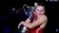 Aryna Sabalenka of Belarus holds the Daphne Akhurst Memorial Cup after defeating Zheng Qinwen of China in the women's singles final at the Australian Open tennis championships at Melbourne Park, Melbourne, on Jan. 27, 2024.