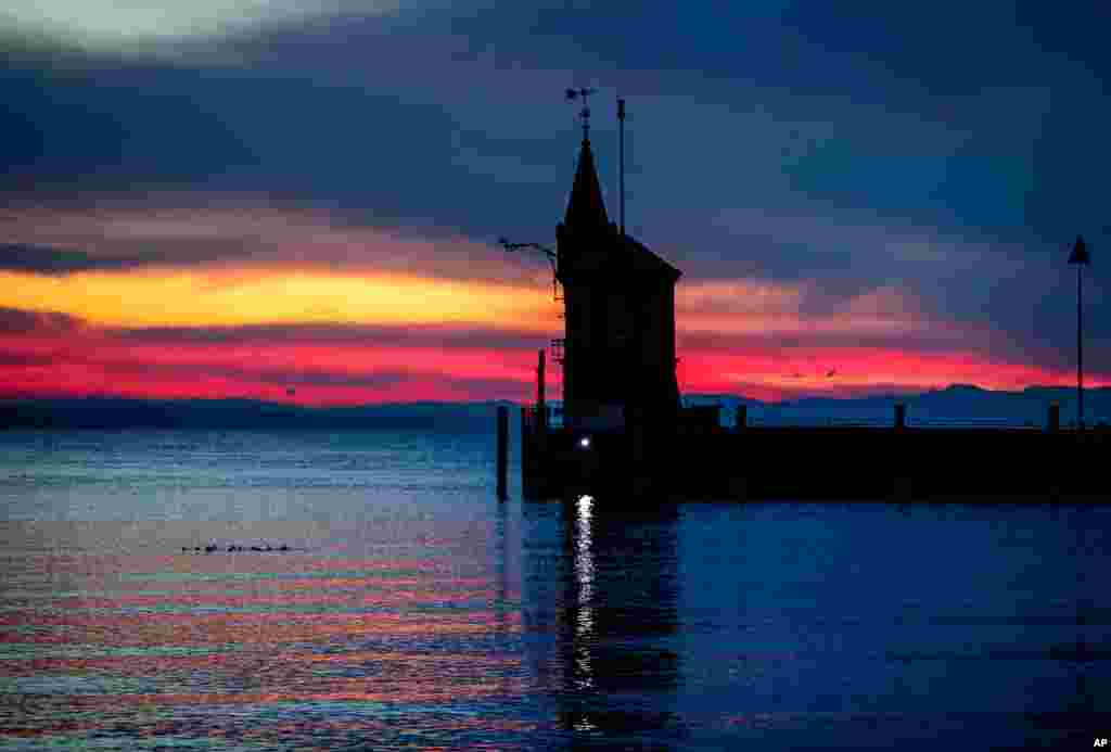 A small tower marks the entrance of the harbor of Constance, Germany.