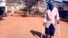 FILE - Malawi’s longest-serving witchcraft prisoner Ezereti Kampota walks to freedom from Maula Maximum Security Prison, in Lilongwe after the Association of Secular Humanism and its Executive Director George Thindwa became advocates for her release, May 31, 2011.