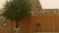 A man walks past the Sankore Mosque, a UNESCO World Heritage Site, in Timbuktu, Mali, April 11, 2012.