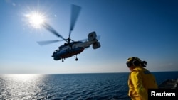 A Ukrainian Ka-27 helicopter takes off from the U.S. Navy Blue Ridge-class command and control ship USS Mount Whitney during the U.S.-Ukraine multinational maritime exercise Sea Breeze 2018 in the Black Sea, July 11, 2018.