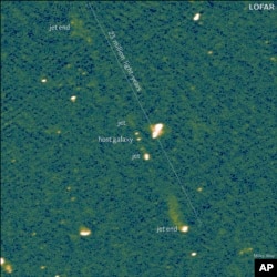 This undated image provided by Caltech, taken by Europe's LOFAR (LOw Frequency ARray) radio telescope, shows the longest known pair of black hole jets, as reported in the journal Nature. (LOFAR Collaboration/Martijn Oei/Caltech via AP)