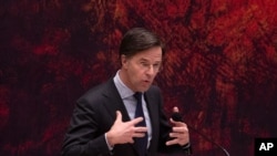 FILE: Dutch Prime Minister Mark Rutte delivers a statement in parliament in The Hague, Netherlands, April 2, 2021.