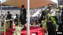 FILE: President Mugabe inspecting a guard of honour in Harare at the National Sports Center.