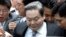 FILE-In this Aug. 14, 2009 file photo, Samsung Group Chairman Lee Kun-hee gets into a car to leave the Seoul Court House after his trial in Seoul, South Korea. South Korean prosecutors have started investigating allegations that ailing Lee bought sex from prostitutes several times between 2011 and 2013.