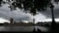 Under a lowering sky people view the Houses of Parliament from across the river Thames following Thursday's EU referendum result, London, June 25, 2016. Britain voted to leave the European Union after a bitterly divisive referendum campaign.