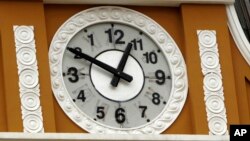 The hands and numbers on the clock at the legislative palace move in reverse in La Paz, Bolivia, June 24, 2014, in the latest symbolic gesture by President Evo Morales government asserting its revolutionary, "anti-colonial nature."