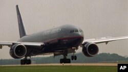 FILE--The first commercial flight by a Boeing 777 arrives at Dulles Airport in Dulles, Virginia, June 1995.
