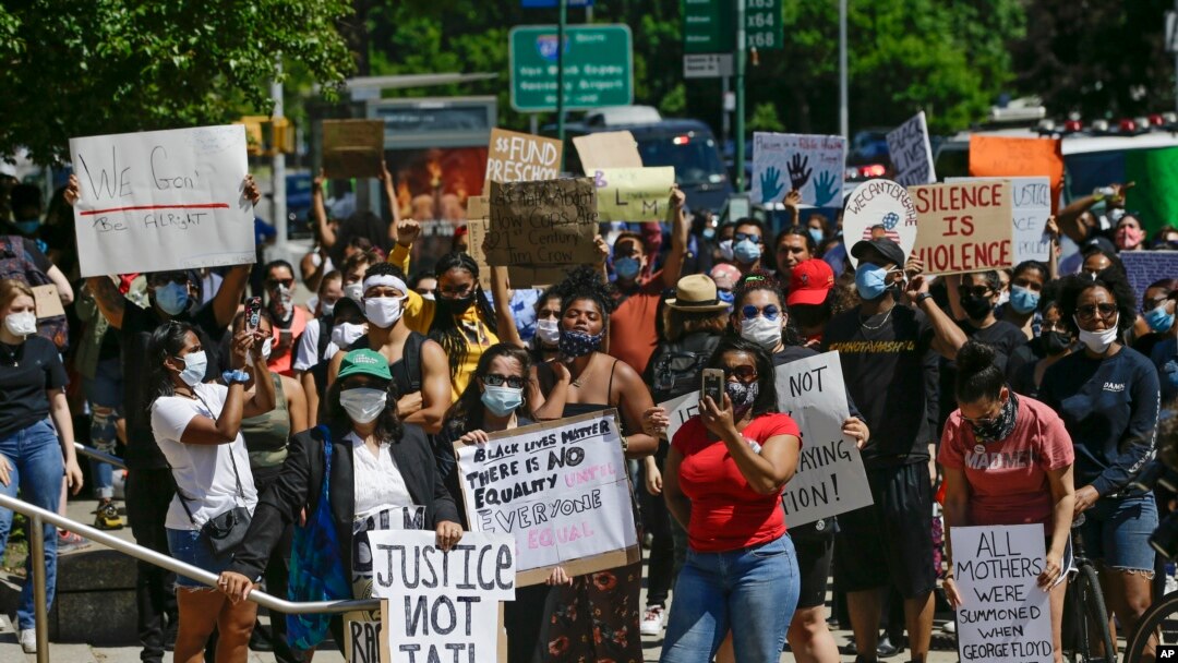 Protesters gather outside of the Queens County Criminal Court in the Queens borough of New York, and demand accountability of police brutality, June 8, 2020.