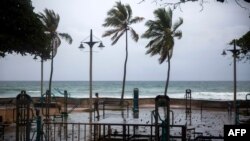 A man exercises under pouring rain during Tropical Storm Isaias in Santo Domingo, Dominican Republic, on July 30, 2020. 