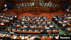 Members of the Kosovo Parliament are seen during a discussion where they rejected a constitutional amendment allowing the creation of a special European Union-backed court, in Kosovo, June 26, 2015. 