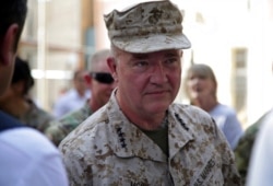 Marine Gen. Frank McKenzie, the head of U.S. Central Command, attends a ceremony where Gen. Scott Miller, not pictured, handed over command, at Resolute Support headquarters, in Kabul, Afghanistan, July 12, 2021.