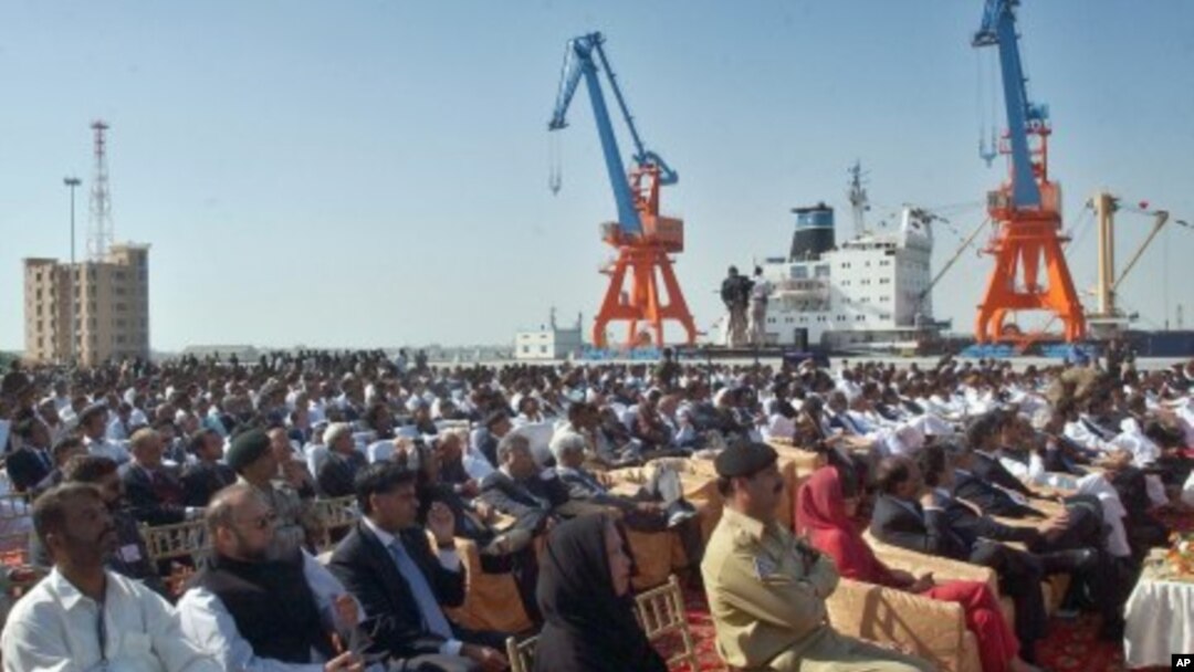 Participants listen to speeches during the opening ceremony of newly built Gwadar port, about 700 kilometers (435 miles) west of Karachi, Pakistan (File Photo - March 20, 2007)