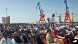 Participants listen to speeches during the opening ceremony of newly built Gwadar port, about 700 kilometers (435 miles) west of Karachi, Pakistan (File Photo - March 20, 2007)