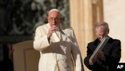 Pope Francis gives his blessing during his weekly general audience in St. Peter's Square, at the Vatican, Wednesday, November 22, 2023. 