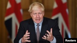 Britain's Prime Minister Boris Johnson speaks during a virtual news conference at Downing Street, London, Sept. 9, 2020. 