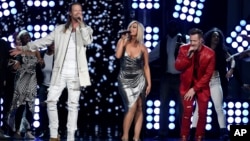 FILE - Tyler Hubbard, right, and Brian Kelley, left, of Florida Georgia Line, and Bebe Rexha, center, perform "Meant to Be" at the 53rd annual Academy of Country Music Awards in Las Vegas, April 15, 2018.