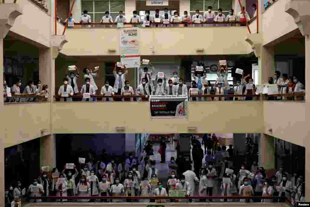 Doctors holding placards protest against the assault on a doctor at Nepal Medical College, Teaching Hospital during the lockdown imposed by the government amid concerns about the spread of coronavirus disease (COVID-19) outbreak, in Kathmandu, Nepal.