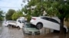 Vehicles sit in a flooded street after a storm in Bahia Blanca, Argentina, March 7, 2025. 