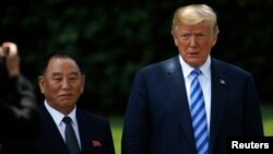 North Korea's envoy Kim Yong Chol is pictured with U.S. President Donald Trump as he departs after a meeting at the White House in Washington, June 1, 2018.