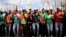 FILE - Mine workers gather at Wonderkop stadium outside the Lonmin mine in Rustenburg, northwest of Johannesburg, South Africa on Jan. 29, 2014. 