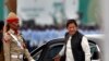 FILE - Pakistani Prime Minister Imran Khan arrives to attend a military parade in Islamabad, Pakistan, March 23, 2019.