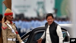 FILE - Pakistani Prime Minister Imran Khan arrives to attend a military parade in Islamabad, Pakistan, March 23, 2019.