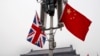 FILE - British and Chinese national flags on display at the Tiananmen Gate in Beijing, China, Jan. 17, 2008. Beijing confirmed on Jan. 26, 2024, that British businessman Ian Stones had been sentenced to five years in prison in 2022 on an espionage charge.
