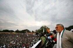 FILE - Former Ghanaian President Jerry Rawlings speaks at a campaign rally for opposition presidential candidate John Atta Mills, in Tema, Ghana, Dec. 5, 2008.