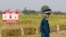 FILE - A Vietnamese soldier stands guard at the dioxin-contaminated area near Bien Hoa airbase, where the U.S. Army stored the defoliant Agent Orange during the Vietnam War, in Bien Hoa city, outside Ho Chi Minh City, Vietnam, October 17, 2018.