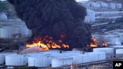 FILE - Firefighters battle a petrochemical fire at the Intercontinental Terminals Company in Deer Park, Texas, March 18, 2019.
