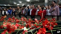 Family members, colleagues and friends of the victims of Tuesday's blasts gather for a memorial ceremony at the Ataturk airport in Istanbul, June 30, 2016.