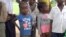 Children wait to be treated at a roadside UNICEF clinic, in Kananga, Democratic Republic of Congo. (A. Powell/VOA)
