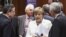 European Central Bank (ECB) President Mario Draghi (L) and Italy's Prime Minister Mario Monti (R) listen to Germany's Chancellor Angela Merkel during a European Union leaders summit in Brussels June 29, 2012.