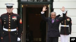 Pakistan’s Foreign Minister Tariq Fatemi waves upon arrival at the White House, March 31, 2016 in Washington, during the nuclear security summit. Fatemi is back to discuss anti-terrorism measures and human rights.